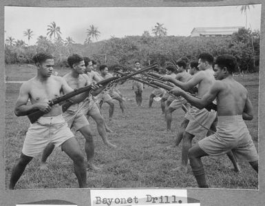 Members of the Tonga Defence Force of 2nd NZEF, during a bayonet drill in Tonga