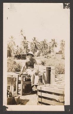 [Soldier Sitting on a Crate]