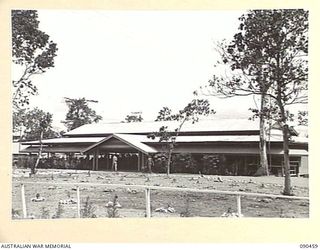 LAE, NEW GUINEA. 1945-04-08. THE EXTERIOR OF THE OTHER RANKS MESS, DURING THE VISIT OF SENATOR J.M. FRASER, ACTING MINISTER FOR THE ARMY, TO THE AREA