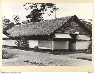 LAE AREA, NEW GUINEA, 1945-08-10. EXTERIOR VIEW OF THE HOBBY HUT, 112 CONVALESCENT DEPOT, ONE OF THE EDUCATION CENTRES UNDER THE COMMAND OF THE DEPUTY ASSISTANT DIRECTOR OF EDUCATION, LAE BASE ..