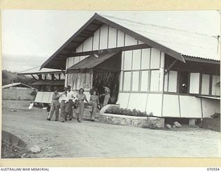 PORT MORESBY, PAPUA, 1944-02-20. MEMBERS OF THE AUSTRALIAN ARMY MEDICAL WOMEN'S SERVICE WITH ESCORTS LEAVING THE AUSTRALIAN WOMEN'S SERVICES CLUB WHICH IS CONDUCTED BY THE AUSTRALIAN ARMY CANTEENS ..