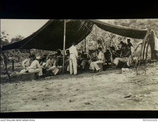 Apoka Valley, Papua. c. 1942-03. The Regimental Band, 135th Medical Regiment, U.S. Army, playing in a tent in the grounds of the Port Moresby Evacuation Hospital. In 1942-05 the Regimental Band was ..