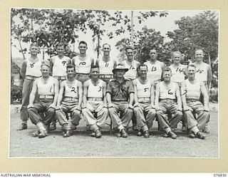 LAE, NEW GUINEA. 1944-11-11. THE PHYSICAL TRAINING INSTRUCTORS AND THEIR OFFICER- IN- CHARGE AT THE 112TH CONVALESCENT DEPOT. IDENTIFIED PERSONNEL ARE: STAFF SERGEANT G. FAHEY (1), SERGEANT C.J. ..