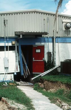 A close-up view of damage sustained by Trader Andy's Hut, a pierside bar and grill, during an earthquake that struck the region on August 8th