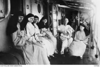 Father Gerard Peekel, a Catholic priest and five nuns, Sisters M Brigitta, M Aquilina, M Arkadia, M Gustava and M Aggesta on board HMAS Swan en route to Rabaul. They were taken prisoner of war ..