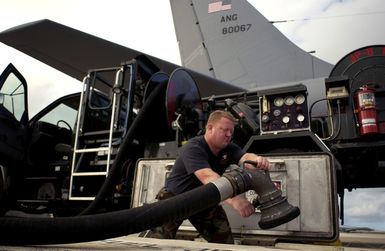 MASTER SGT. Sam Tweit, a fuels technician with the 116th Air Refueling Squadron, Washington Air National Guard, based at Fairchild Air Force Base (AFB), Wash., prepares to refuel a KC-135 Stratotanker aircraft before a mission during their deployment at Andersen AFB, Guam, on Nov. 23, 2004. (USAF PHOTO by STAFF SGT. Bennie J. Davis III) (Released)