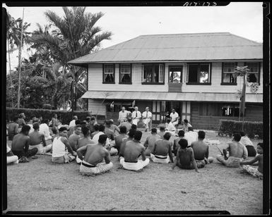 The High Commissioner discussing local problems with village chiefs, Samoa