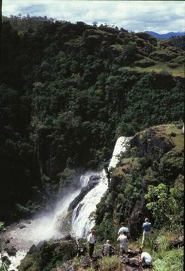 “Rouna Falls” (original caption). Tourists by the waterfall.