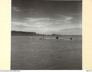 MARKHAM RIVER, NEW GUINEA. 1944-06-27. A CRASHED UNITED STATES ARMY AIR FORCE P.38 LOCKHEED LIGHTNING AIRCRAFT. THE TWIN TAIL FINS ARE SEEN TOWARDS THE RIGHT OF THE PHOTOGRAPH