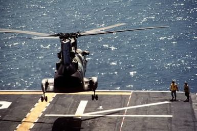 A CH-46E Sea Knight helicopter of Marine Medium Helicopter Squadron 261 (HMM-261) lands on the flight deck of the amphibious assault ship USS SAIPAN (LHA-2) during Operation Sharp Edge. Marines of the 22nd Marine Expeditionary Unit (22nd MEU) are being sent to the U.S. Embassy in Monrovia, Liberia, to augment security and evacuate U.S. and foreign nationals from the fighting between government and rebel forces