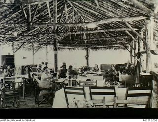 Aitape, New Guinea. 1945-01. Interior of the Sisters' Mess with nurses relaxing at the river side camp of the 2/11th Australian General Hospital (2/11AGH). Identified personnel are WFX34695 Sister ..