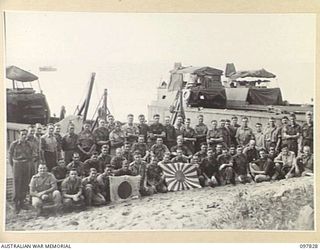 KAHILI, BOUGAINVILLE. 1945-10-08. PERSONNEL OF 42 LANDING CRAFT COMPANY. THE BARGE CREWS WORKED TWELVE HOURS A DAY TRANSPORTING 18,900 JAPANESE TROOPS FROM THE BUIN AREA TO FAURO ISLAND