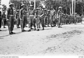 TOROKINA, BOUGAINVILLE ISLAND. 1944-12-06. VX38969 MAJOR-GENERAL W. BRIDGEFORD, CBE, MC, GOC, 3RD DIVISION (3) INSPECTING TROOPS OF THE 15TH INFANTRY BATTALION. IDENTIFIED PERSONNEL ARE:- QX42374 ..