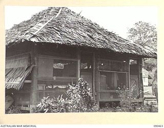 LAE, NEW GUINEA. 1945-04-08. THE OLD TYPE SAC-SAC (SAGO PALM) SLEEPING QUARTERS AT HEADQUARTERS FIRST ARMY