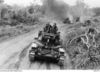 BOUGAINVILLE. 1945-03-30. NO. 9 TROOP, B SQUADRON, 2/4 ARMOURED REGIMENT MATILDA TANKS MOVING ALONG THE TOKO-DARARA ROAD IN THE MOVE FORWARD TO SUPPORT ADVANCING INFANTRY. THIS IS THE FIRST TIME ..