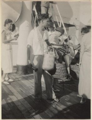 Pitcairn islanders on board the S.S. Rotorua, selling beads, baskets and walking-sticks to the tourists, 1935