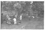 Groups with baskets of breadfruit?