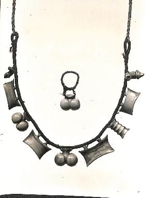 Photo of carved objects, possibly jewellery