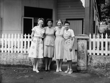 [Group portrait of four women]