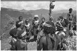 Pig festival, singsing preparations, Tsembaga: young dancers in grass bustles and shell valuables sing