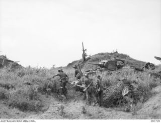 WEWAK AREA, NEW GUINEA. 1945-05-10. STRETCHER BEARERS CARRYING OUT A CASUALTY DURING THE FIERCE BATTLE FOR THE JAPANESE BASE OF WEWAK IN WHICH TROOPS OF 2/4 INFANTRY BATTALION ARE SUPPORTED BY ..