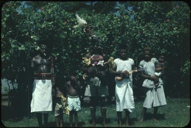 Policeman Maia [Maeya] (the guard for the Malaria Control Service building) and his family ready for singsing (1) : Rabaul, New Britain, Papua New Guinea, 1960-1961 / Terence and Margaret Spencer