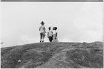 Pete Vayda with men at top of hill