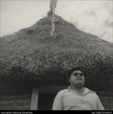 Man in the doorway of a house