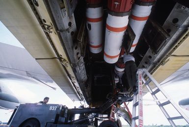 Members of the 43rd Munitions Maintenance Squadron load Mark 52 training mines into a 43rd Strategic Wing B-52G Stratofortress aircraft during Exercise TEAM SPIRIT '85