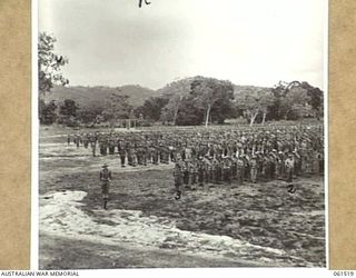 POM POM VALLEY, NEW GUINEA. 1943-11-30. 2/12TH AUSTRALIAN INFANTRY BATTALION FORMED UP FOR AN INSPECTION BY THE COMMANDING OFFICER, QX6008 LIEUTENANT COLONEL C. C. F. BOURNE. IDENTIFIED PERSONNEL ..