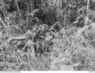 WEWAK AREA, NEW GUINEA, 1945-06-17. STRETCHER BEARERS CARRYING OUT CASUALTIES DURING THE ATTACK BY B COMPANY, 2/8 INFANTRY BATTALION AGAINST HILL 2. IDENTIFIED PERSONNEL ARE:- PTE P.C. SKLAVOS (1); ..