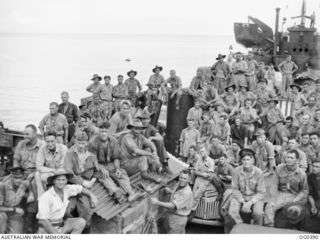 KIRIWINA, TROBRIAND ISLANDS, PAPUA. C. 1943-11-30. INFORMAL GROUP PORTRAIT OF AIRMEN OF NO. 6 MOBILE WORKS SQUADRON RAAF WHO MOVED FROM KIRIWINA TO NADZAB BY USA LCTS (LANDING CRAFT, TANK), ON THE ..