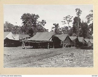 SORAKEN AREA, BOUGAINVILLE, 1945-05-03. THE CAMP LINES, 11 INFANTRY BRIGADE. SECTIONS OF THE CAMP AREA ARE STILL UNDER CONSTRUCTION