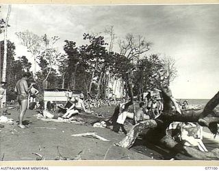 LAE AREA, NEW GUINEA. 1944-11-26. ALLIED SERVICE PERSONNEL ENJOYING A PICNIC ON THE BEACH NEAR HEADQUARTERS, LAE BASE SUB AREA