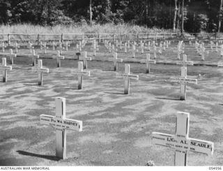 SOPUTA, NEW GUINEA, 1943-07-20. GRAVES IN THE SOUTH-WEST CORNER OF THE SOPUTA WAR CEMETERY. IN THE FOREGROUND ARE THE CROSSES OF PRIVATE W. A. HARVEY AND LANCE CORPORAL A. L. SEARLE