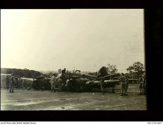 Ward's Airfield, Papua. 1943-06-11. Beaufighter aircraft (A19-101, LY-D) of No. 30 Squadron RAAF on the airfield after crash landing due to hydraulic failure. (Donor K. Delbridge)