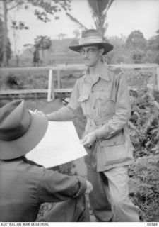 Lae, New Guinea. c. 1944-07-25. Mr Gavin Long, Official Australian War Historian, Military History Section, attached to HQ, New Guinea Force