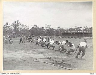 WONDECLA AREA, QLD. 1945-01-19. THE 2ND HEAT OF THE TUG OF WAR EVENT DURING THE 9 DIVISION GYMKHANA AND RACE MEETING HELD AT THE HERBERTON RACECOURSE WITHIN THE HQ 9 DIVISION AREA. THE DIVISION A ..