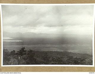 MILNE BAY, NEW GUINEA, 1943-07-12. PANORAMIC VIEW OF THE AREA AT THE BACK OF MILNE BAY, TAKEN FROM HILL STATION ROAD, LOOKING IN THE DIRECTION OF THE WAIGARI AREA