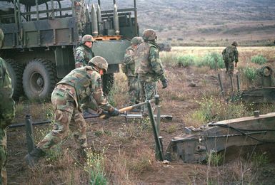 Marines from Bravo Battery, 1ST Battalion, 12th Marines, 3rd Marine Regiment prepare a M198 155mm Medium Towed Howitzer for rocket assist projectiles during a combined arms live fire exercise. The M198 is constructed of aluminum and steel, and is air transportable by CH-53E helicopter and C-130 or larger fixed-wing aircraft. Maximum effective range with conventional ammunition is 22,400 meters (13.92 miles) and with a rocket-assisted projectile, 30,000 meters (18.64 miles)