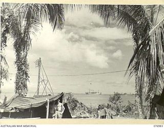 JACQUINOT BAY, NEW BRITAIN. 1944-11-17. THE BAY FROM THE WUNUNG PLANTATION SHOWING THE PORTABLE RADAR UNIT OF THE 472ND HEAVY ANTI-AIRCRAFT TROOP