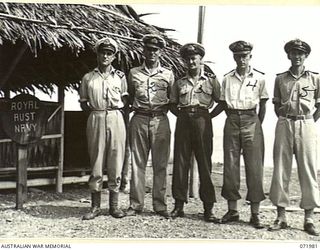 LAE, NEW GUINEA. 1944-04-01. OFFICERS OF THE ROYAL AUSTRALIAN NAVAL VOLUNTEER RESERVE WHO ARE NOW MEMBERS OF THE PORT DIRECTOR'S STAFF, AT HEADQUARTERS LAE RAN PORT DIRECTORATE. IDENTIFIED ..