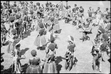 Dancers standing in a circle, Papua, ca. 1923 / Sarah Chinnery