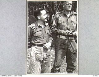 RAMU VALLEY, NEW GUINEA. 1944-01-15. VX81107 LIEUTENANT D. L. THOMAS, ASSISTANT ADJUTANT (1) AND VX81071 LIEUTENANT W. R. LINTON (2) OF THE 57/60TH INFANTRY BATTALION