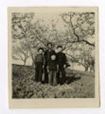Older woman and children outside