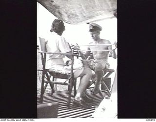 EN ROUTE TO KOIL ISLAND, NEW GUINEA, 1945-10-31. A VISIT TO KOIL ISLAND WAS ARRANGED BY THE RED CROSS FOR THE PURPOSE OF MEDICAL INSPECTION OF THE NATIVE INHABITANTS. THE VISITING PARTY CONSISTED ..