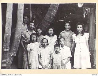 RATONGOR, NEW BRITAIN. 1945-09-19. A COMPLETE CHINESE FAMILY SOON AFTER THEIR LIBERATION FROM THE CHINESE INTERNMENT CAMP WHERE THEY HAD LIVED FOR MORE THAN THREE AND A HALF YEARS UNDER JAPANESE ..