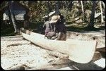 Carving a canoe