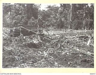 MADANG, NEW GUINEA. 1944-10. A CHURCHILL MK VII TANK BEING RECOVERED DURING TESTS CONDUCTED AT HQ 4 ARMOURED BRIGADE