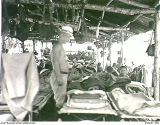 THE SOLOMON ISLANDS, 1945-10-13. LIVING QUARTERS FOR JAPANESE NAVAL PERSONNEL AT THEIR INTERNMENT CAMP ON MASAMASA ISLAND. (RNZAF OFFICIAL PHOTOGRAPH.)